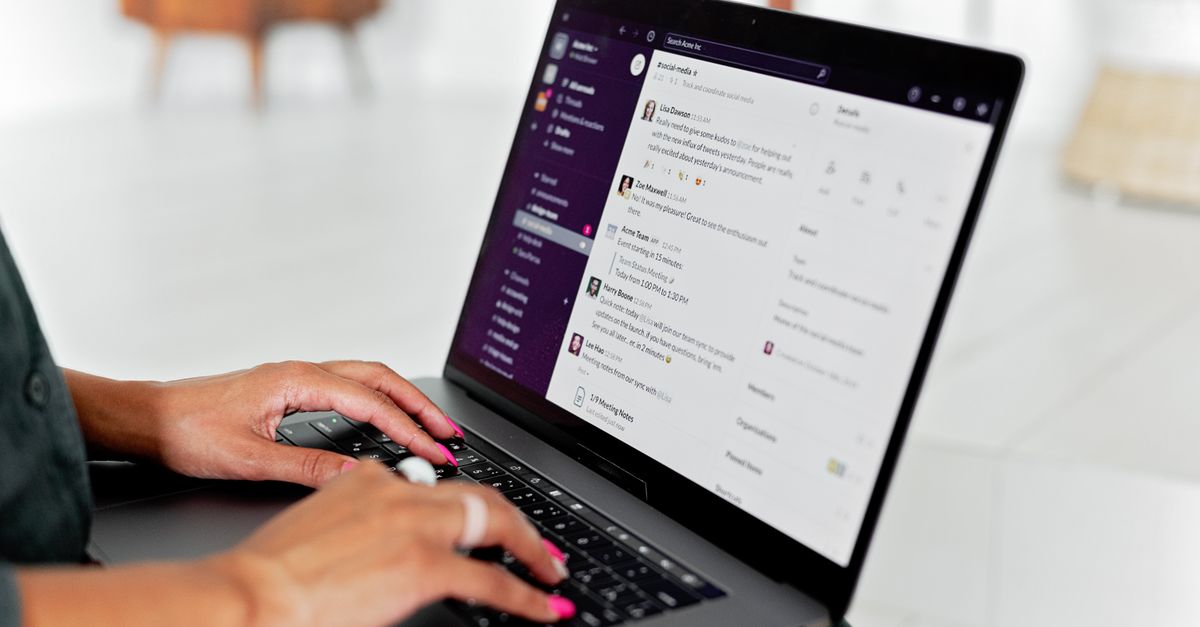 A laptop showing email notifications for a website workflow.
