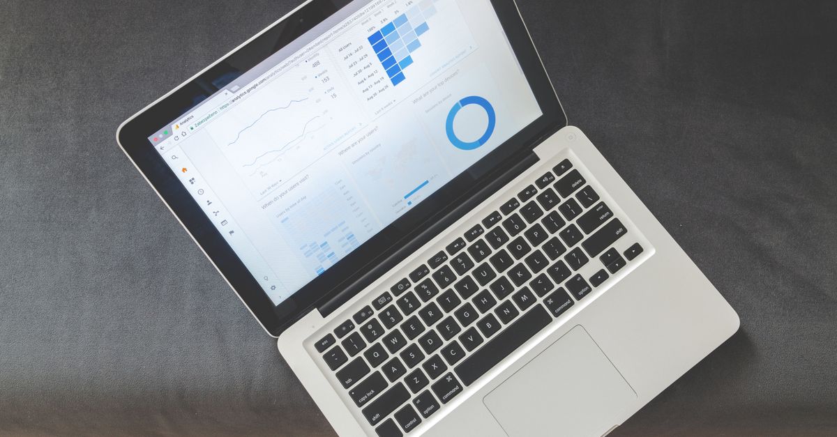 A newsletter analytics dashboard on a laptop.