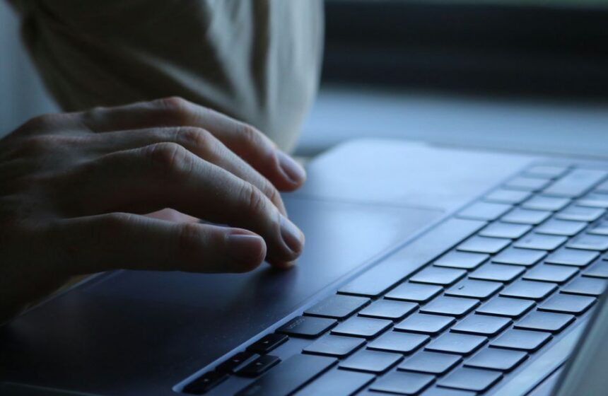 A laptop showing email preferences beside a checklist.