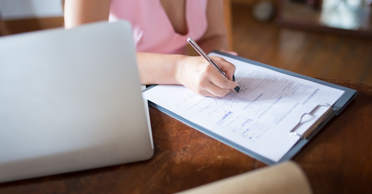 A person creating a signup form with a preference dropdown on a laptop.