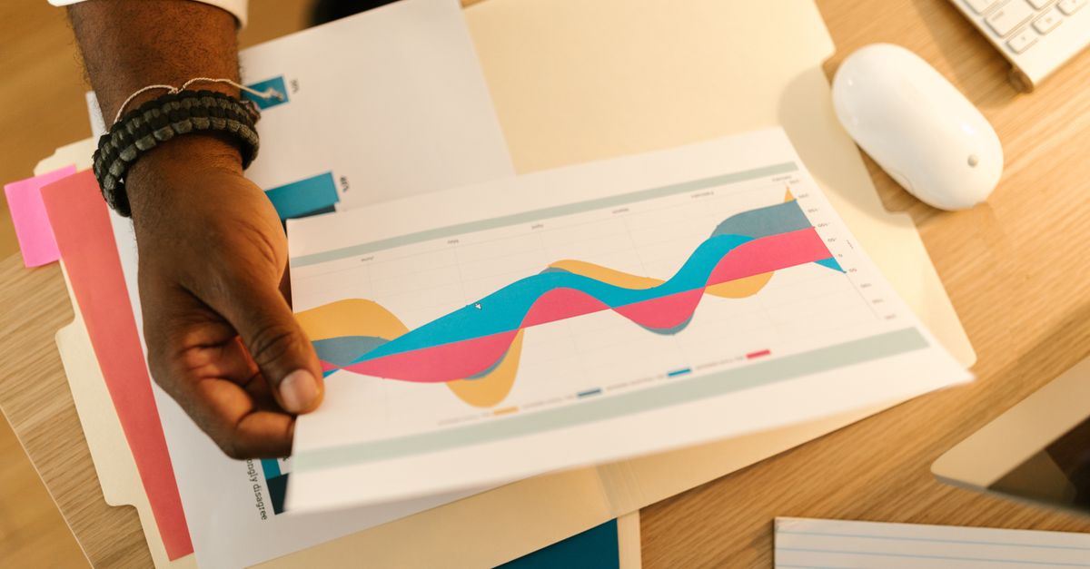 A printed email stats report with highlighted open rates.